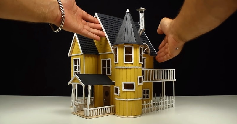 simple miniature house made of popsicle sticks