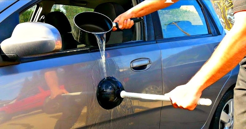 Using Boiling Water And A Plunger To Remove Car Dents